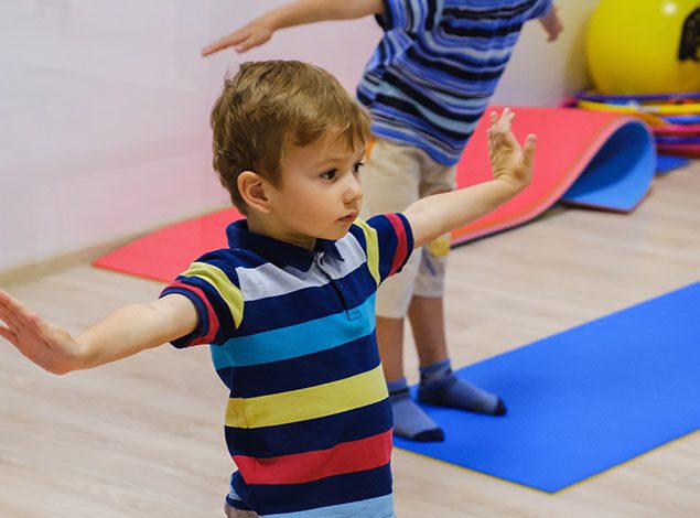 child playing in gym