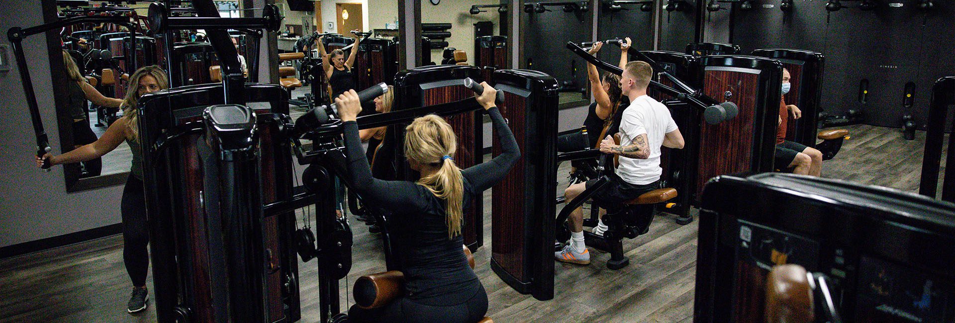 people working out with modern gym equipment