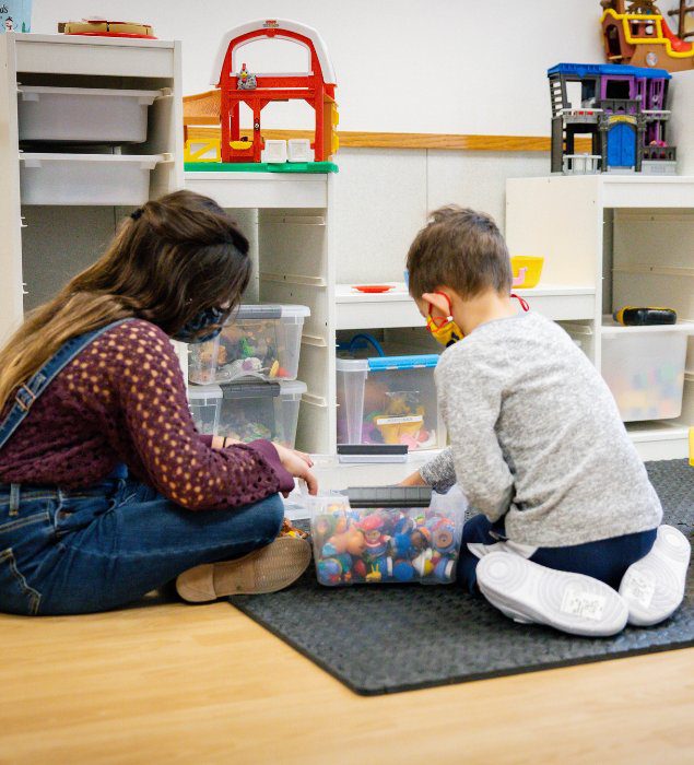 kids playing in dedicated childcare room in modern gym